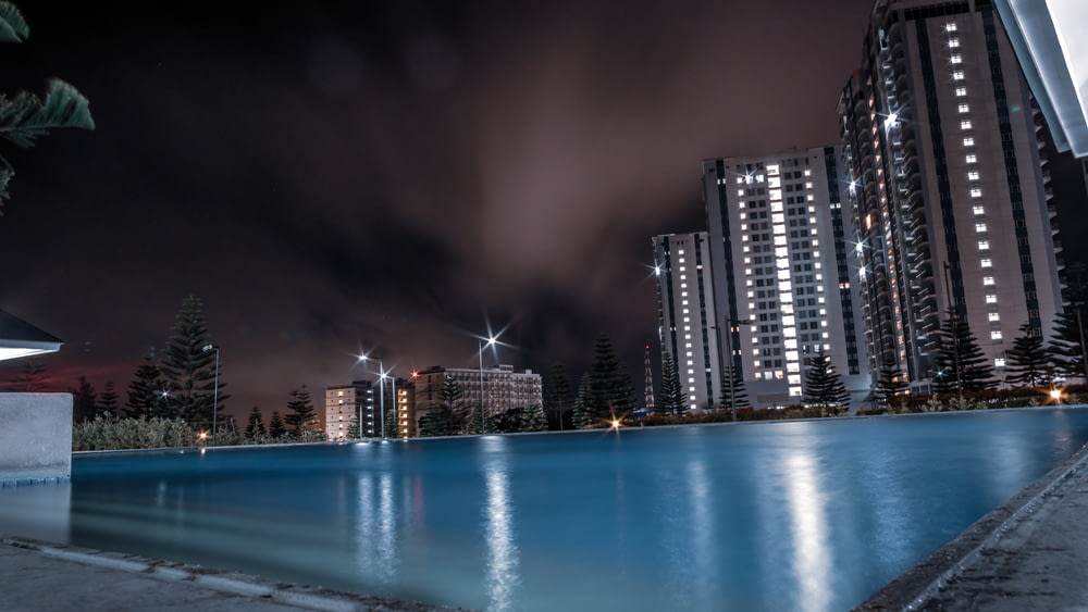 swimming pool near building at night.jpg